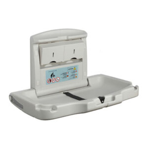 Seinälle taitettava harmaa hoitopöytä.